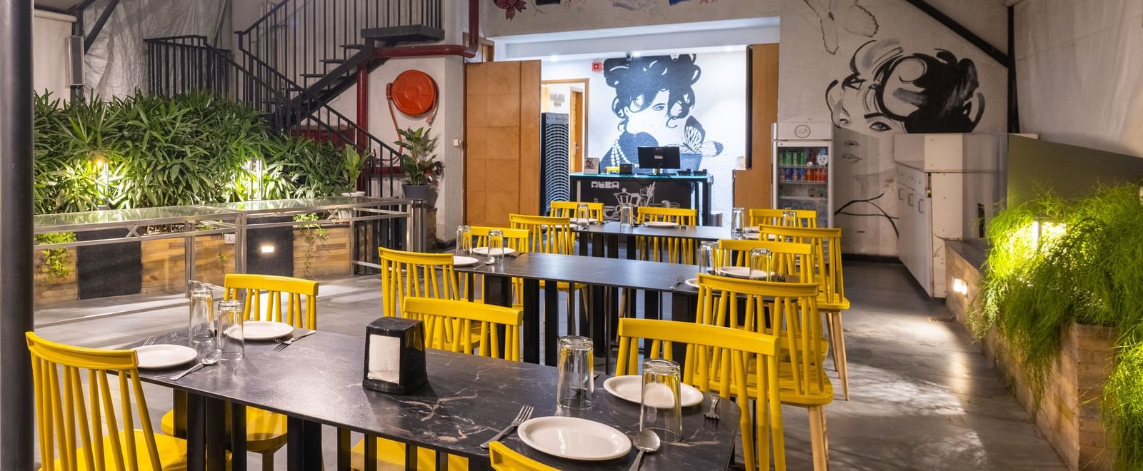 Rooftop dining setup in the Pravasa Cafe at Pravasa Stay Vijay Nagar, Indore.