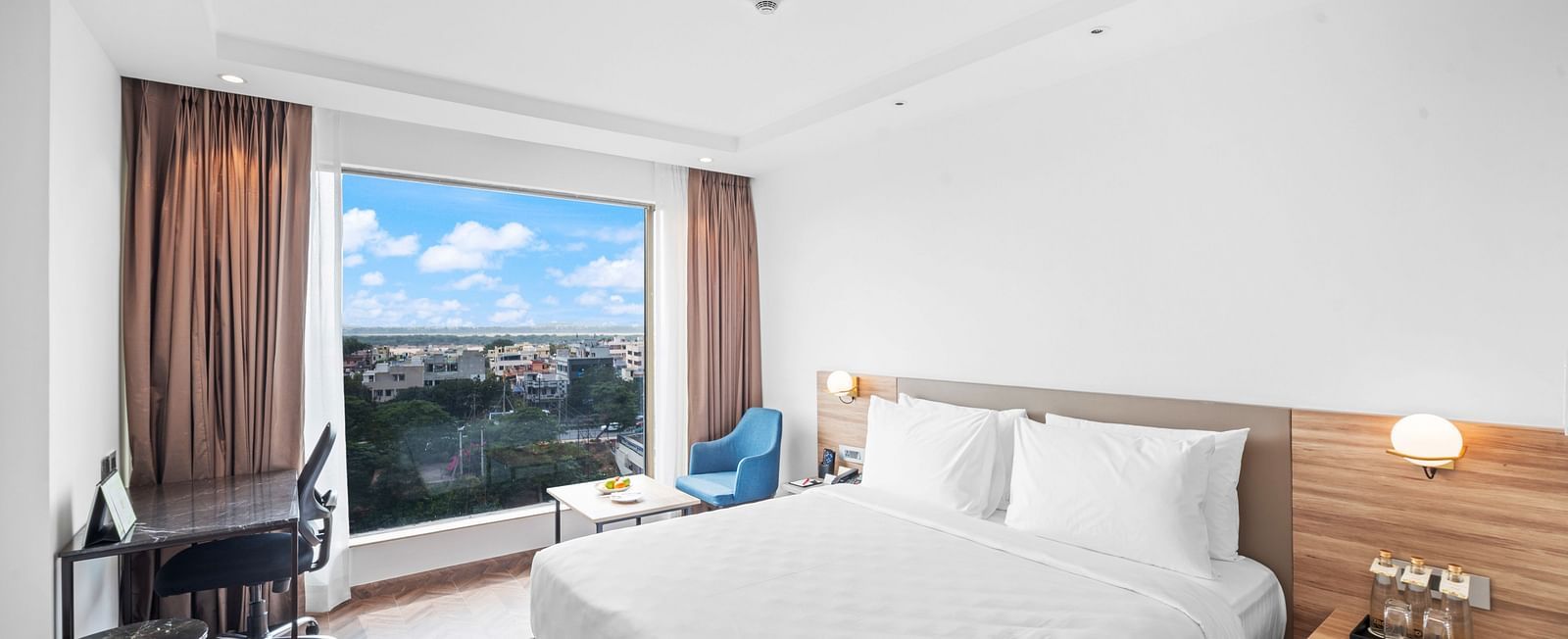 An image of a king size bed of a Grand Club Room at Grand Vijayawada by GRT Hotels.