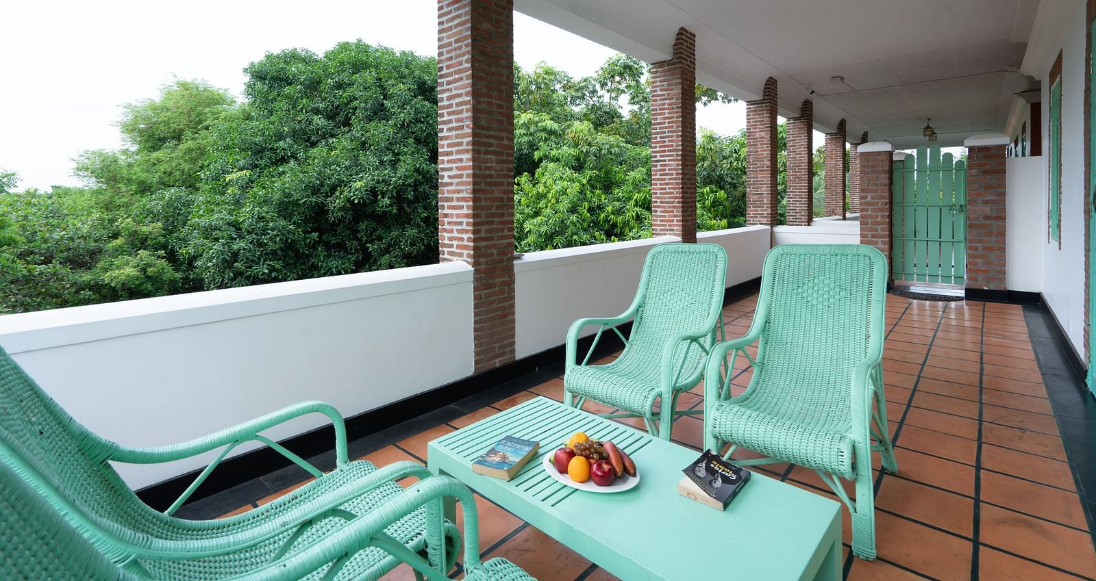 Suite Balcony  with turquoise chair and table.