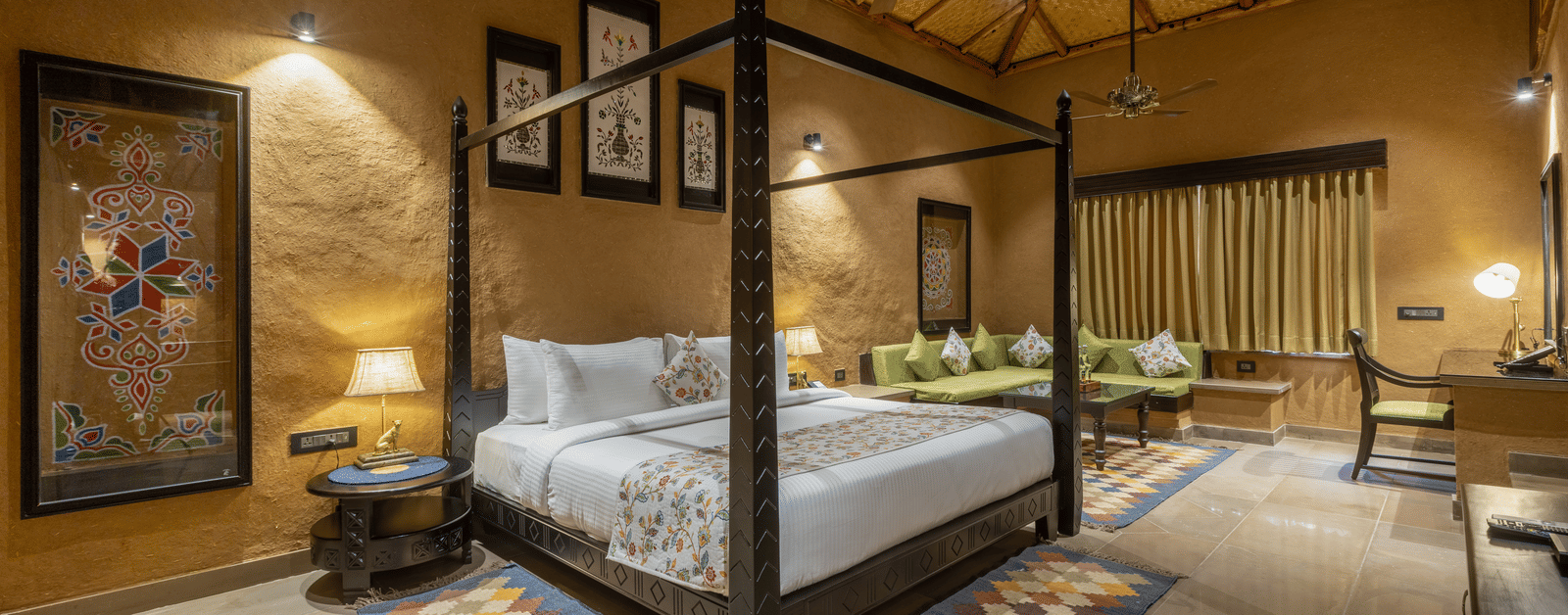 NRN A bright bedroom at Aamaghati Wildlife Resort featuring a four poster bed, chic décor, and comfortable furnishings in a serene setting.-HDR