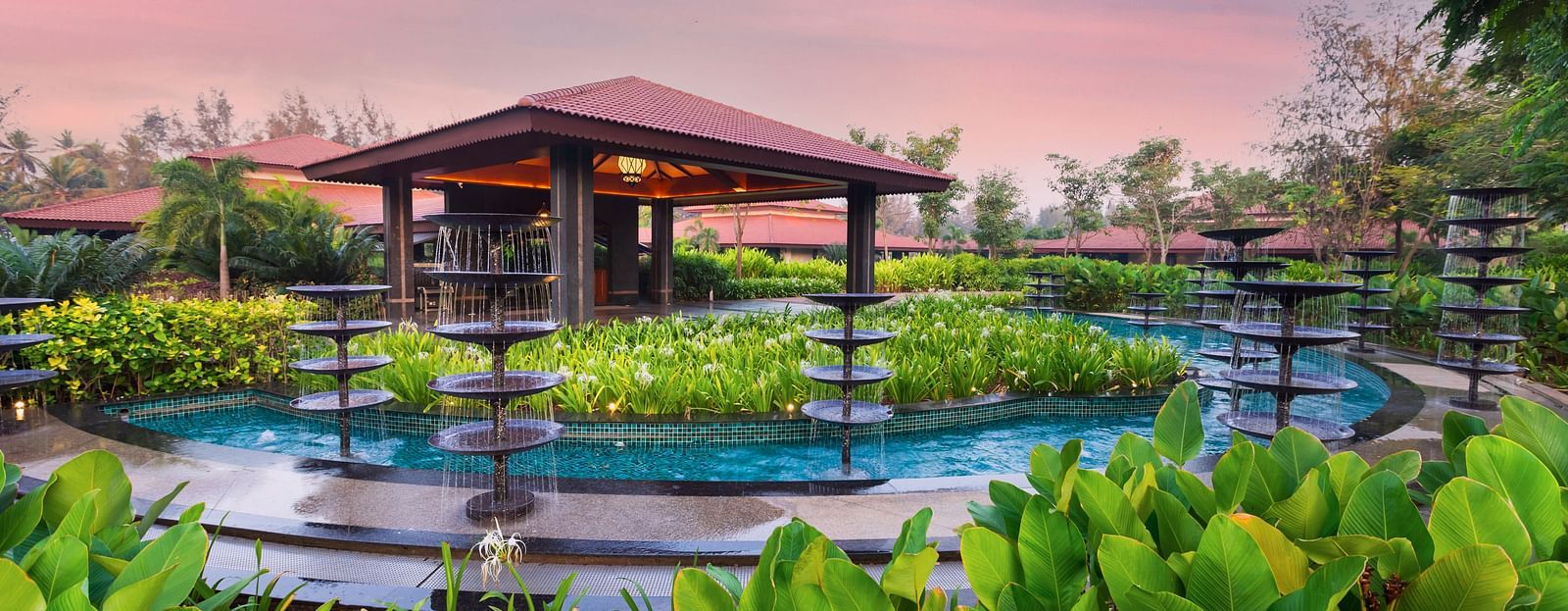 An overview of the swimming pool with a canopy in between - Gamyam Resort