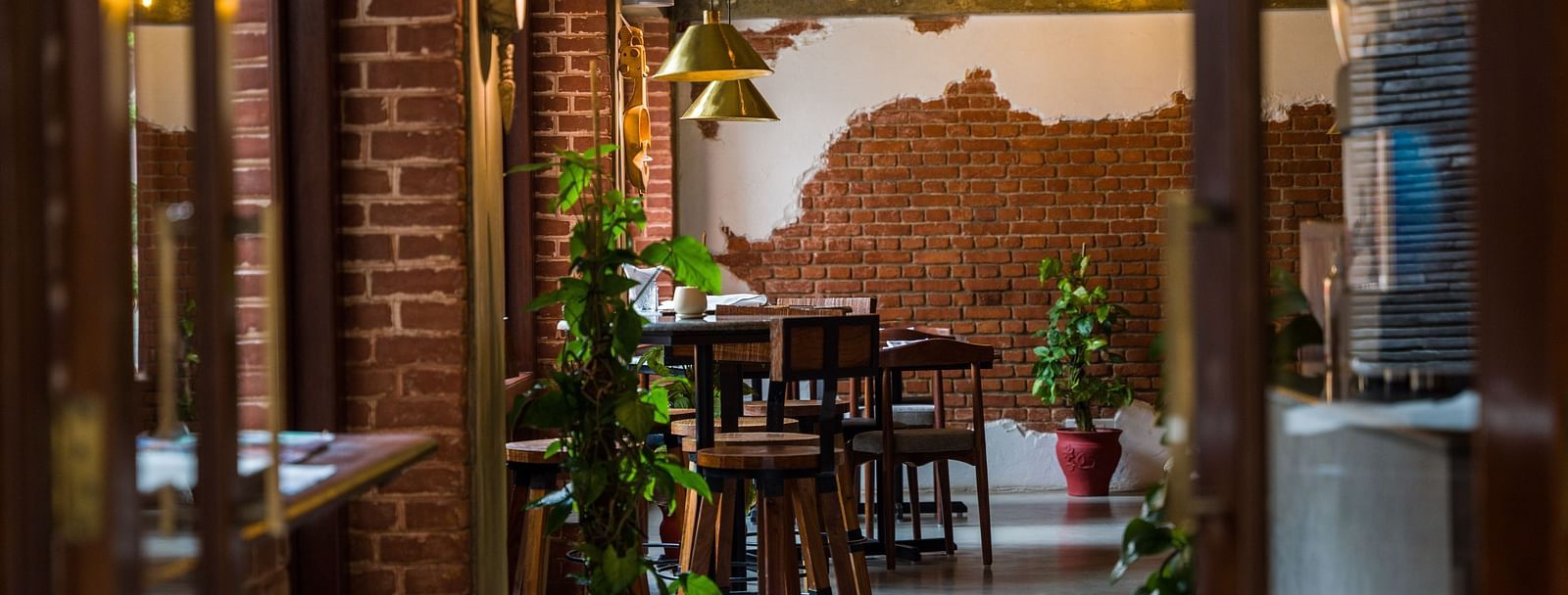 The community bistro at The Nanee with seating arrangement and decorative plants