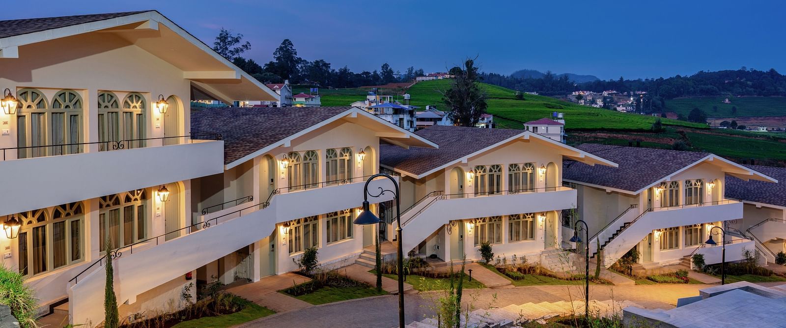 A facade of few buildings in a resort | Mango Hill Shola, Ooty