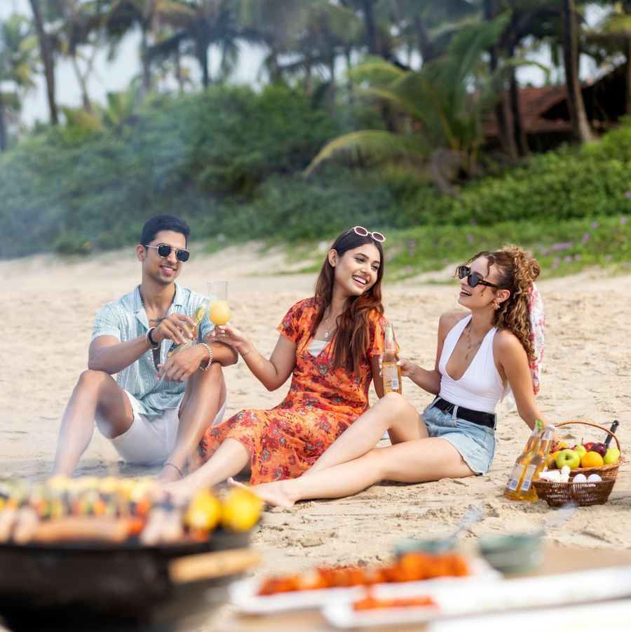 Guests enjoying a beachside BBQ at Heritage Village Resorts & Spa