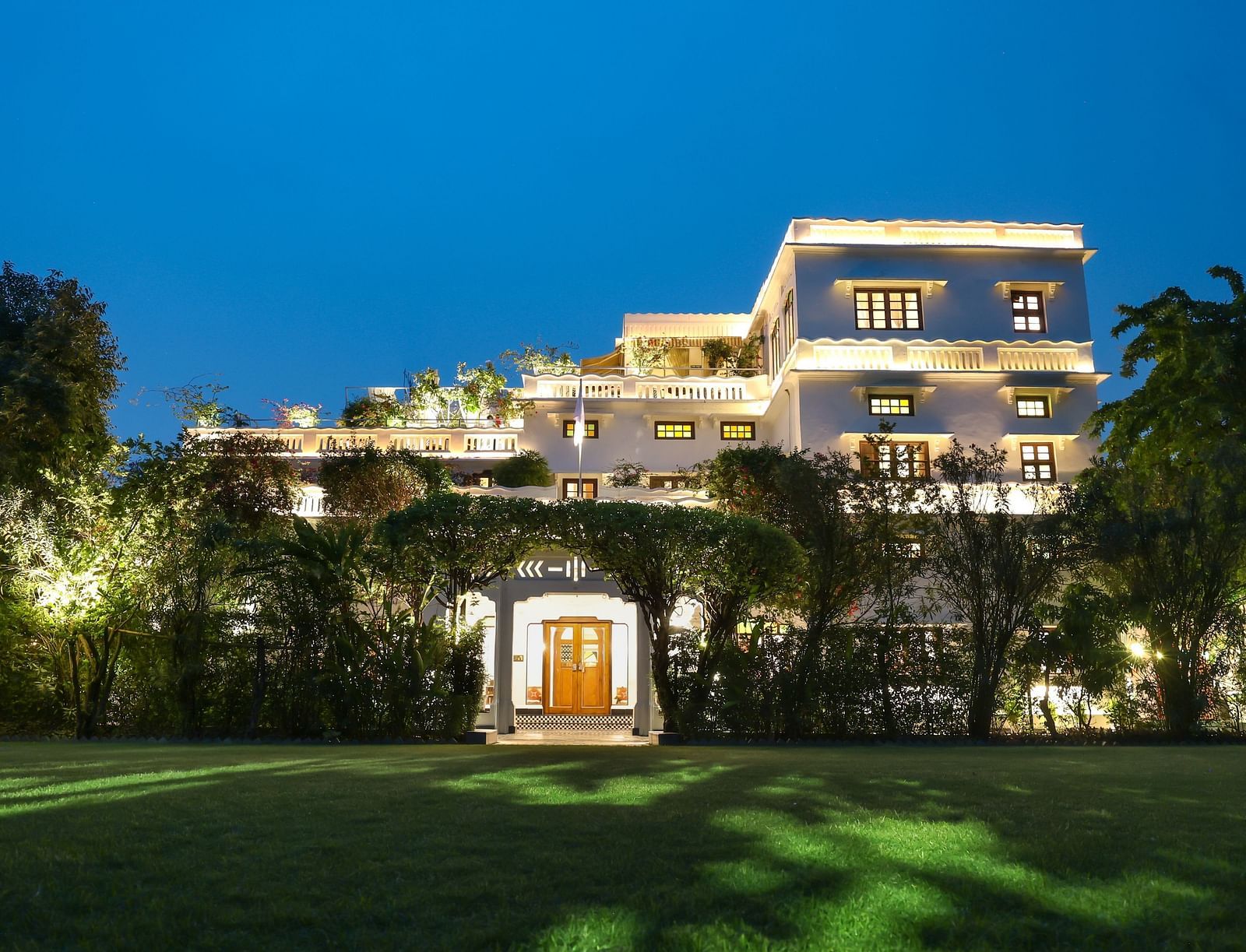 A view of the Saraca Hotel, Lucknow from the garden during blue hour