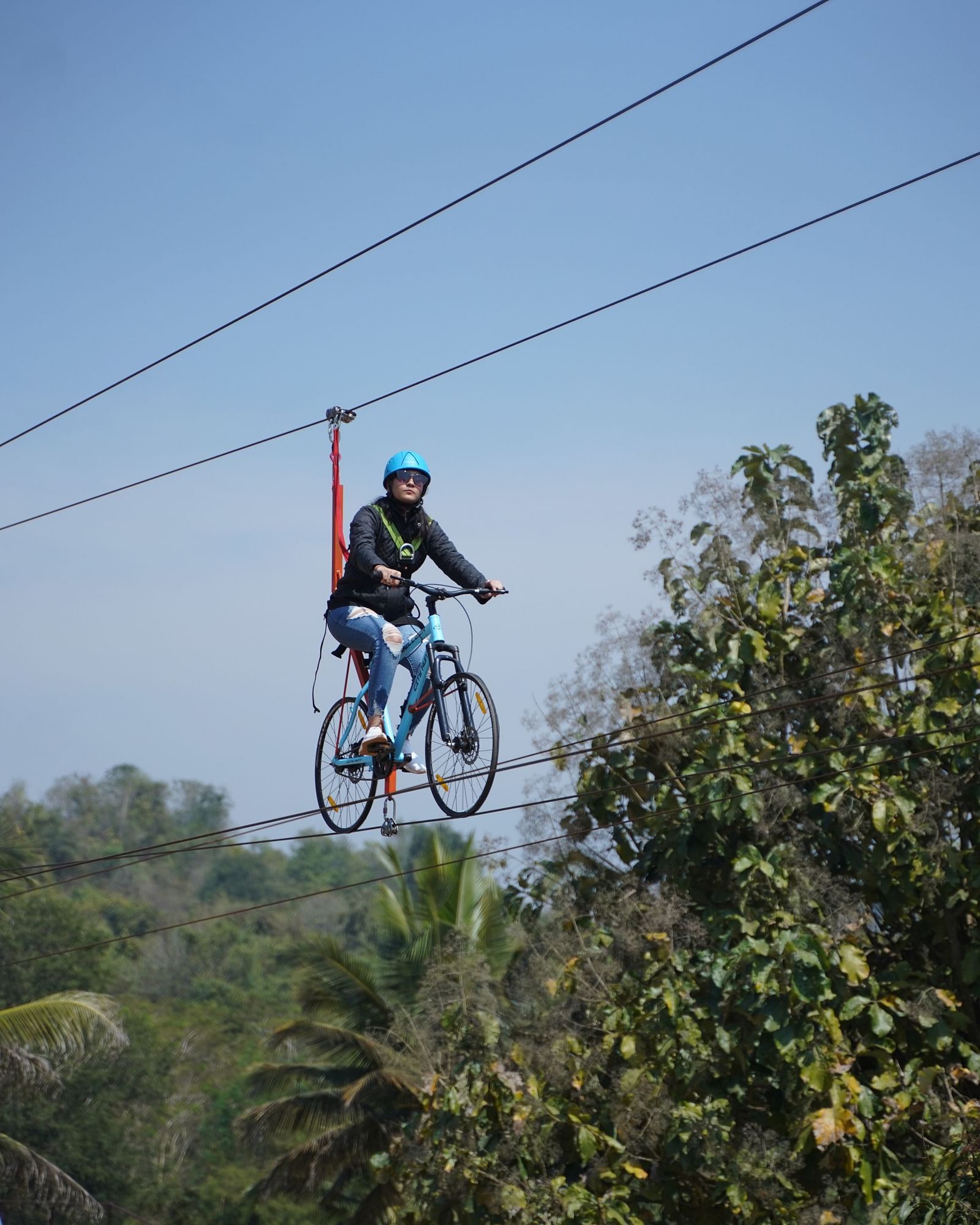 A guest zip cycling at Ravishing Retreat on a sunny day
