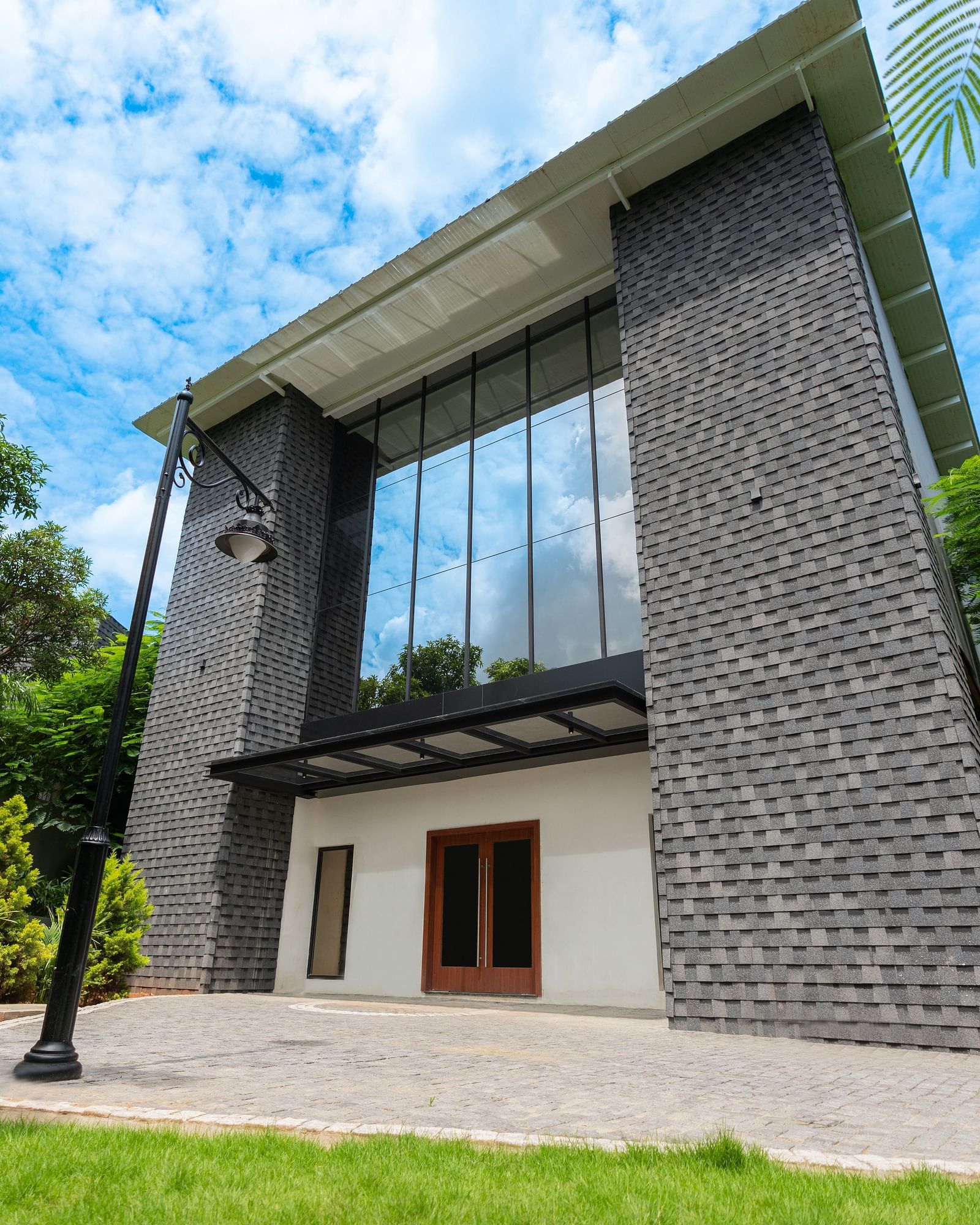 Royal Affair Banquet Hall at Darza Resorts, surrounded by lush green trees, showcasing one of the top marriage halls in Coimbatore.