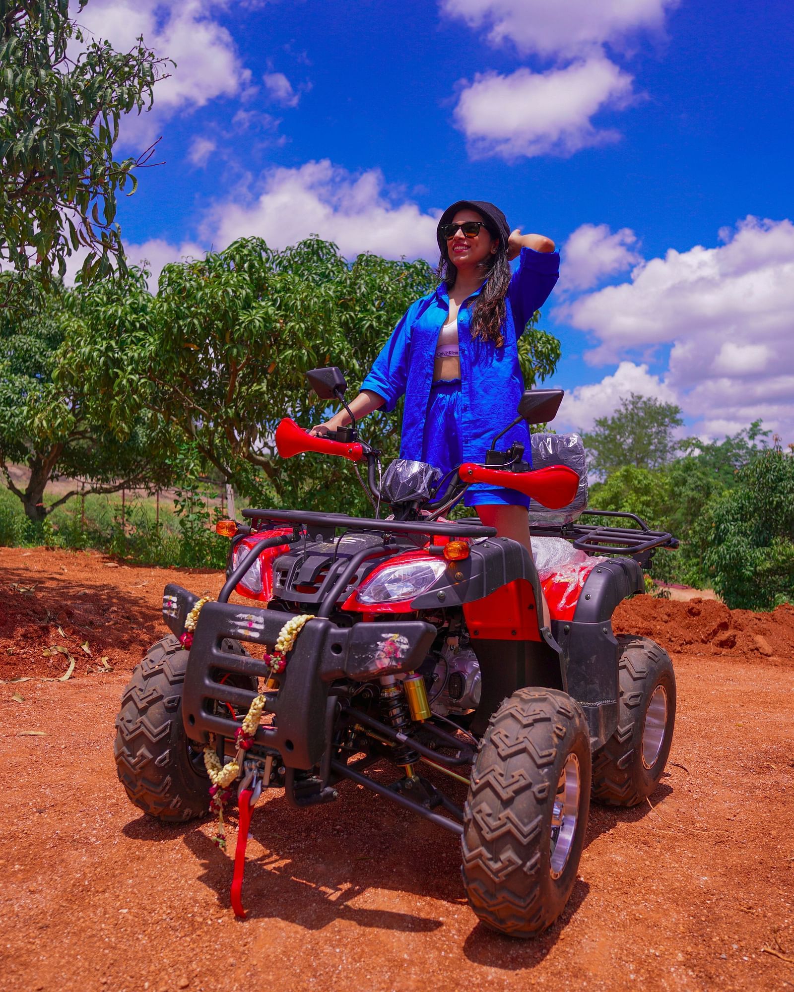 Ravishing Retreat Ramanagara - A guest standing on the ATV at our resort