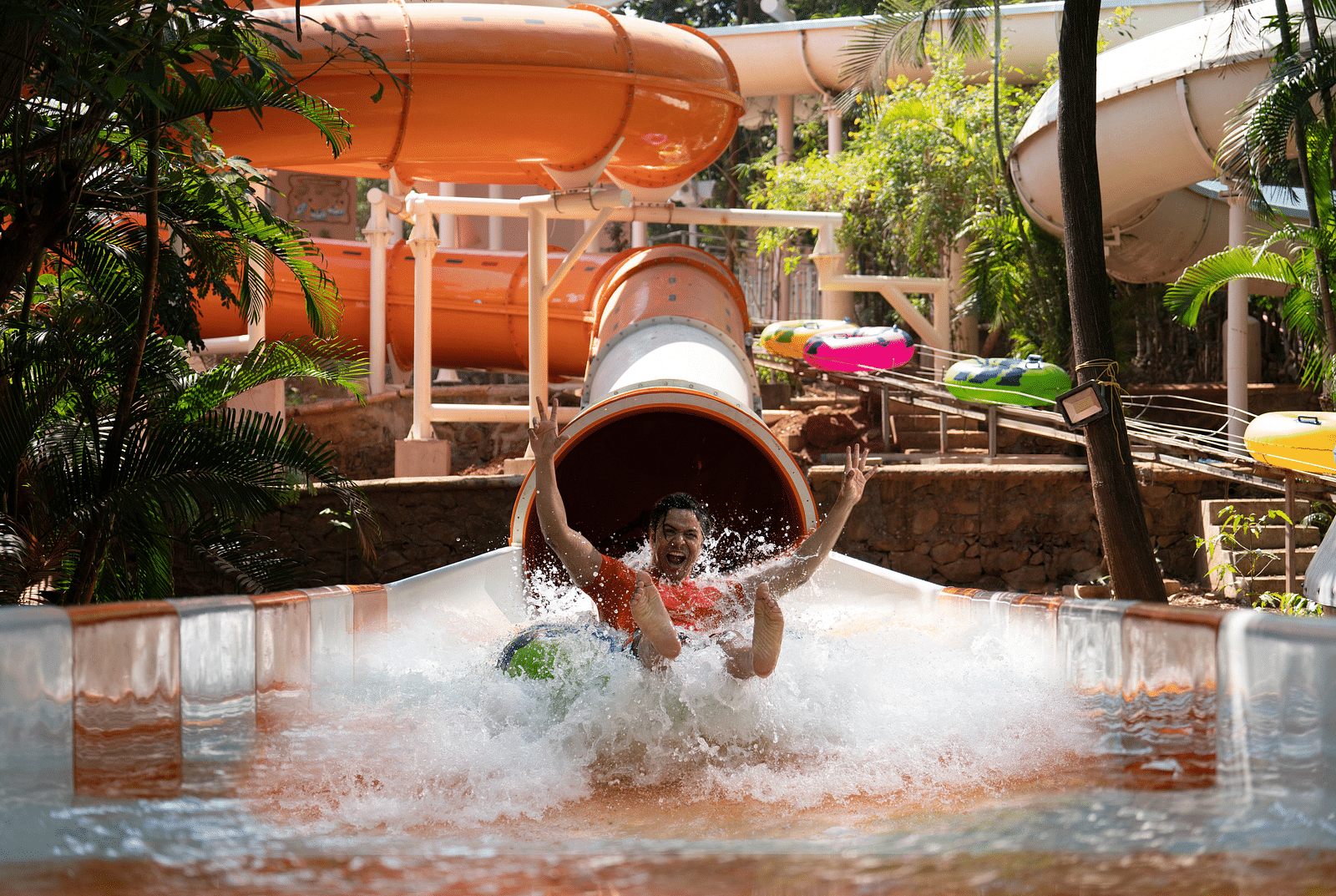 An image of the Aquadrenaline Vortex at Water Kingdom where a man is sliding down into the water