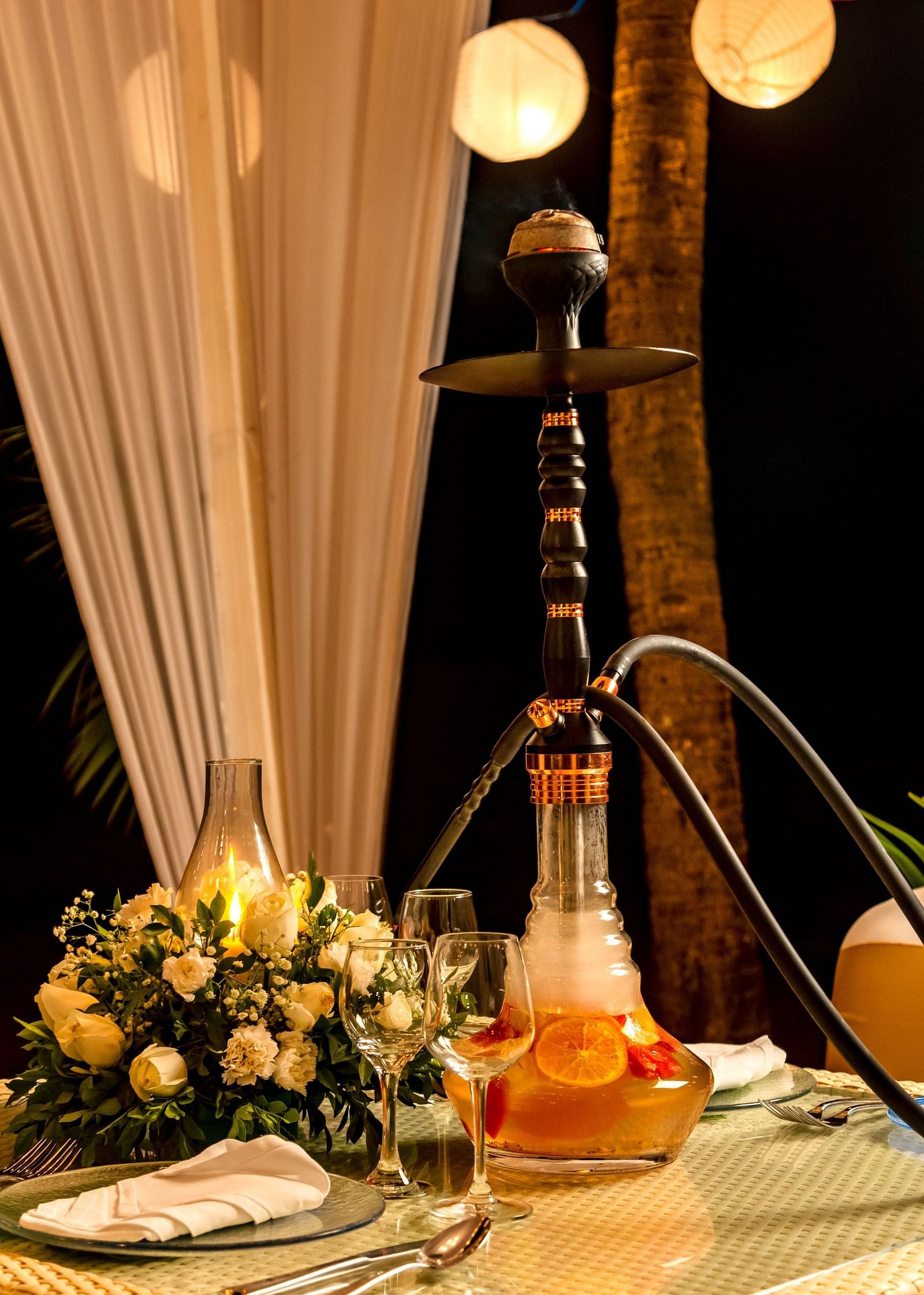 al fresco seating arrangement with a hookah pipe on it - Caravela Beach Resort Goa 