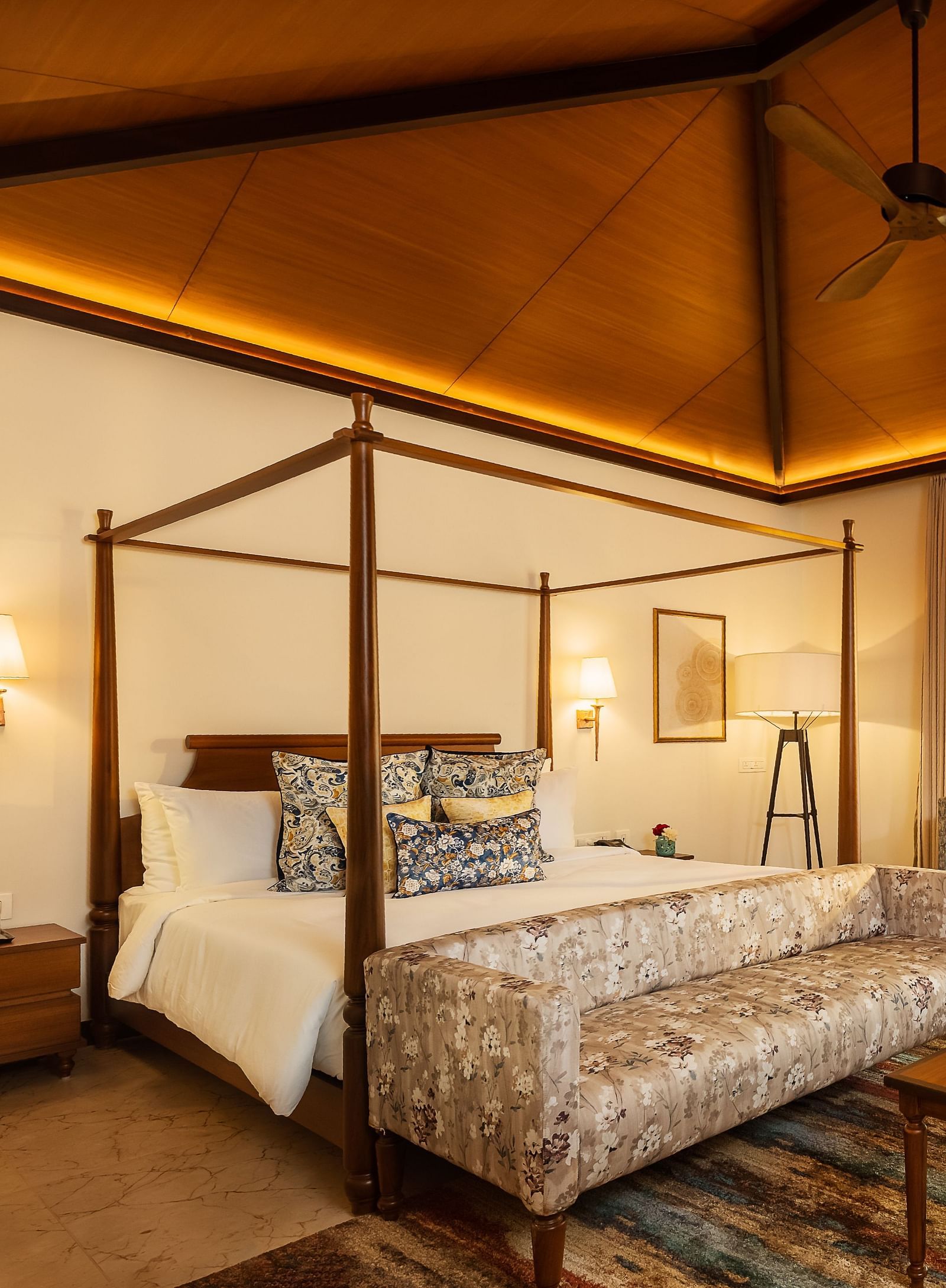 A double bed with side tables and lamps inside Cluster Villa - Gamyam retreat