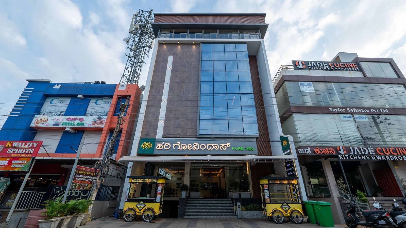 Facade view of Hari Govinda's Express against cloudy sky