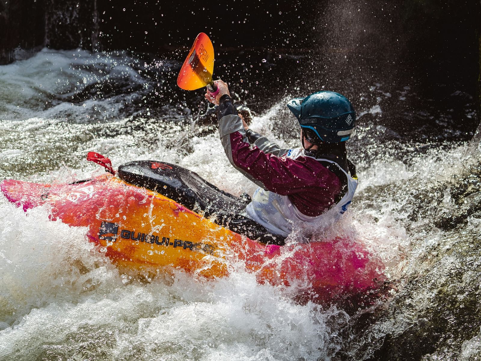 An image of a person kayaking through a river
