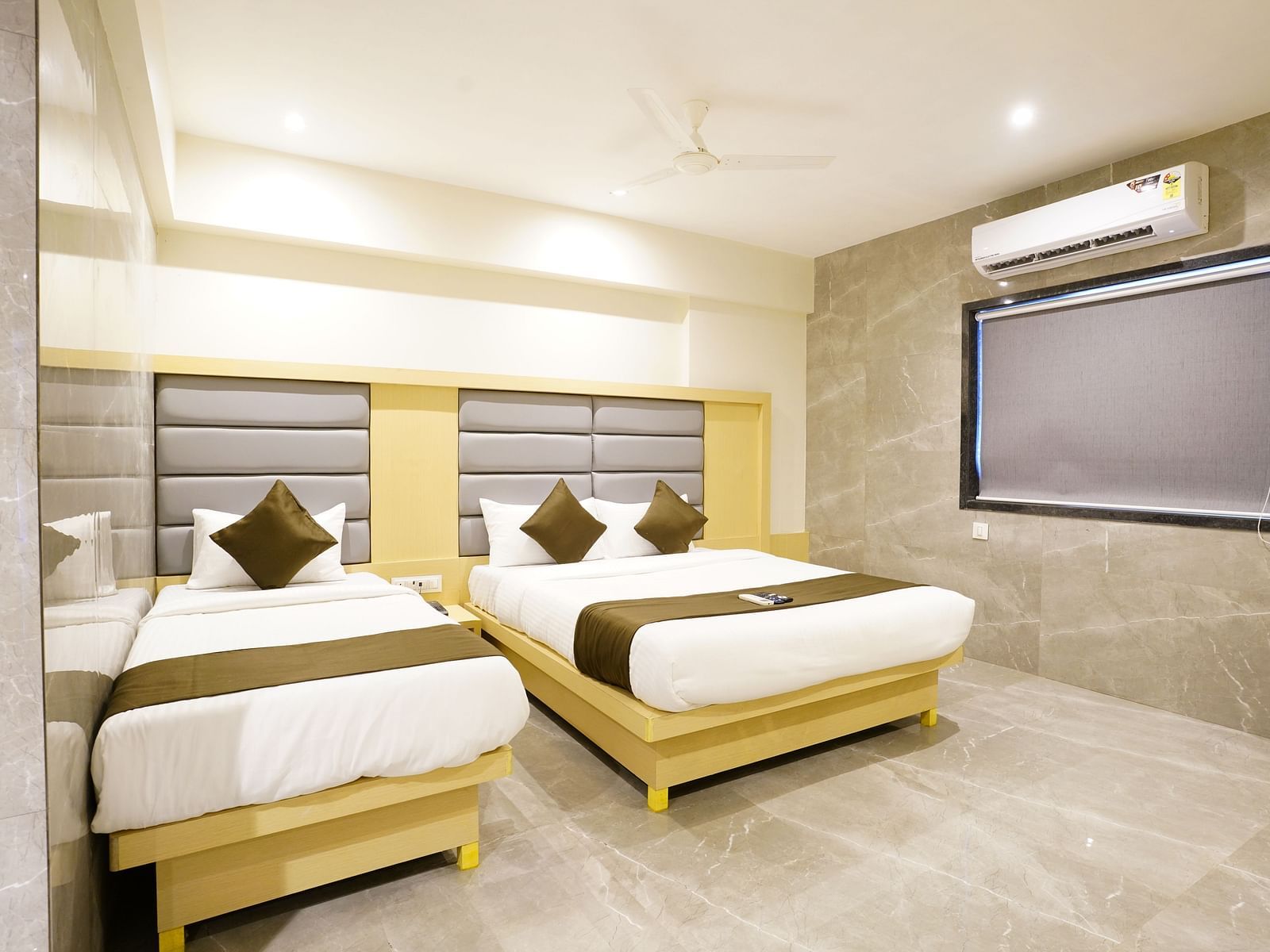 Hotel room with two single beds, wooden headboards, and a window - Shyanu Lords Eco Inn Airoli