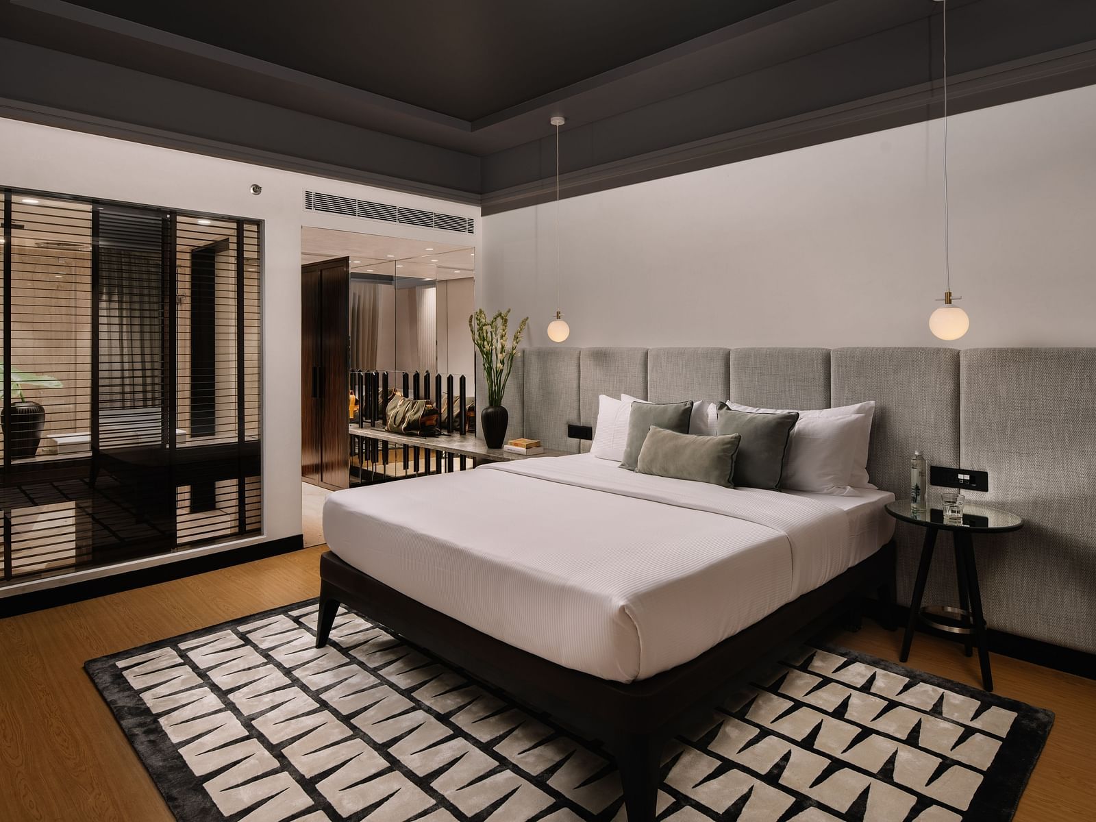 Overview of Apartment room at The Raintree St. Mary s Road with a bed and classy decor.