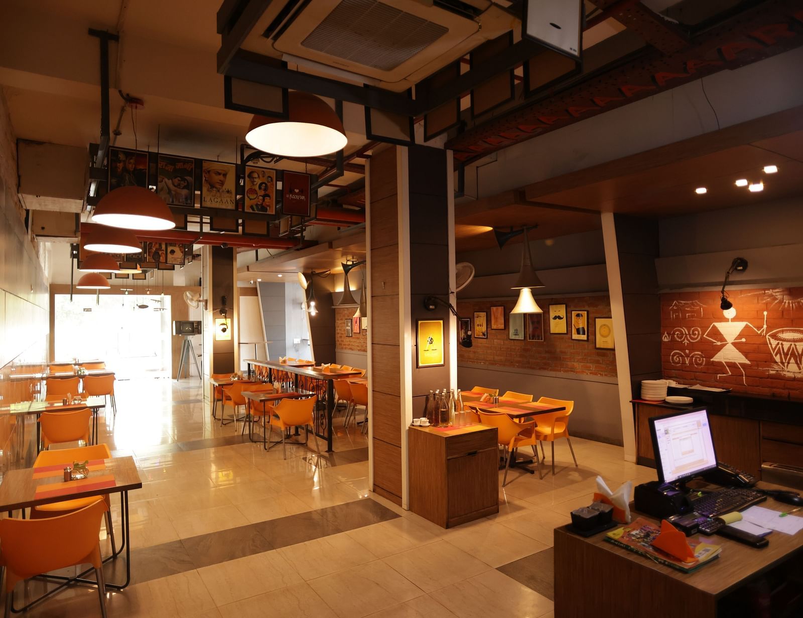 full view image of the dining area with ample walking space around the tables - Max Hotel, Jabalpur