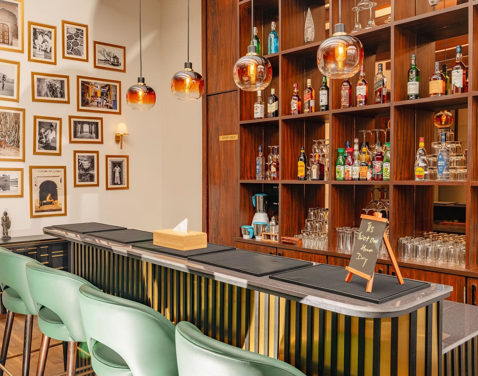Cosy indoor bar with warm lighting and wooden interiors at Nivasana Manali.