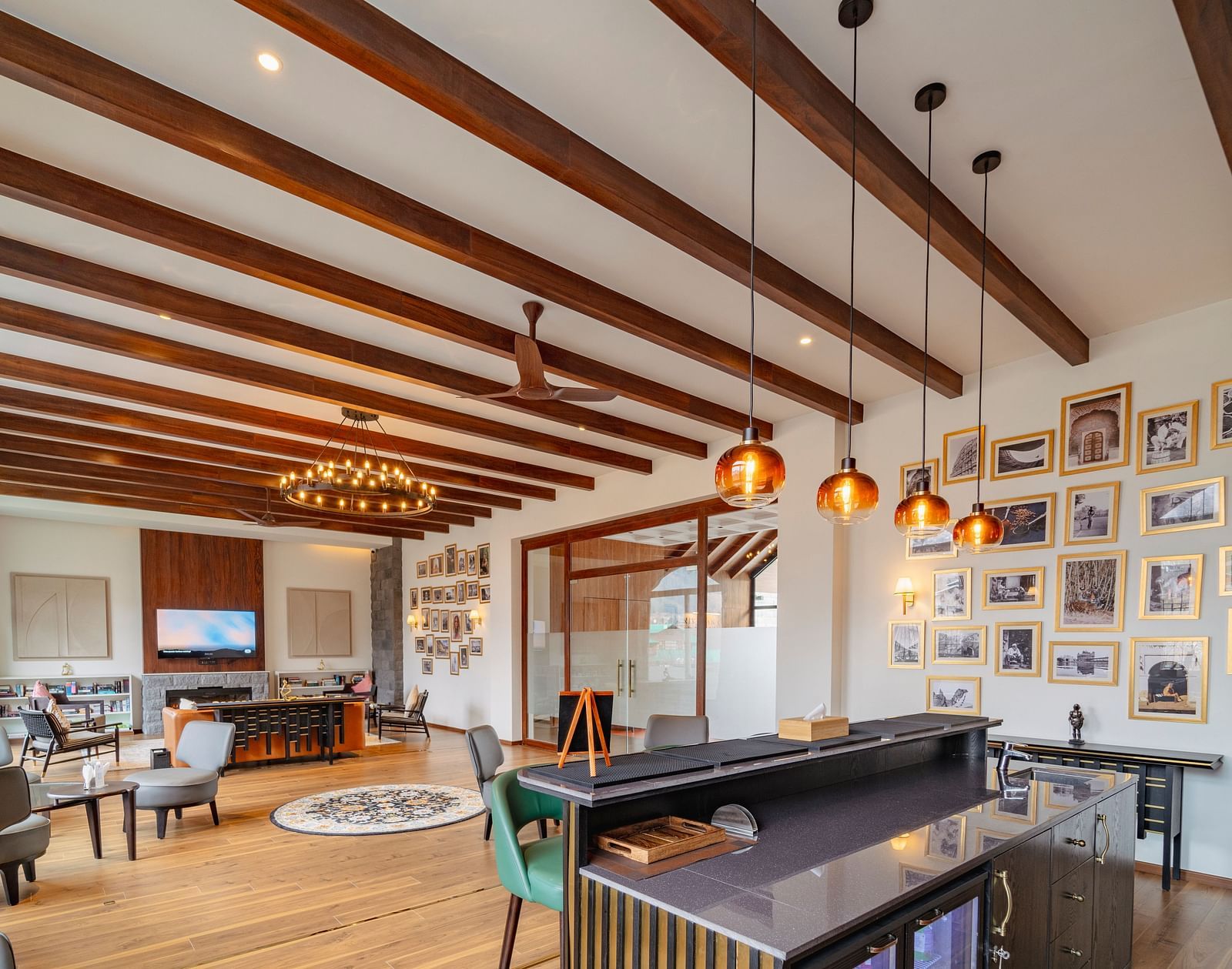 Stylish dining area with wooden beams and framed art at Nivasana Manali.