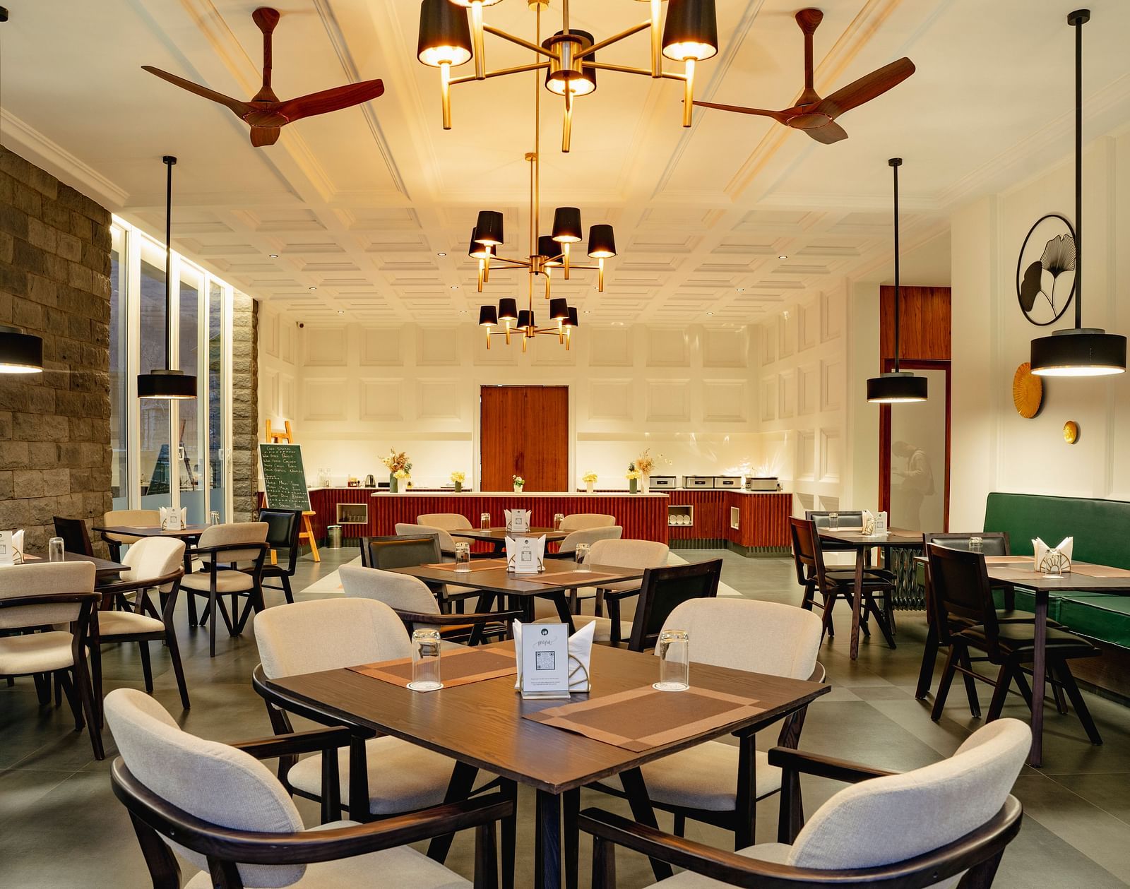 Chic dining space with muted tones and contemporary decor at Nivasana Manali.