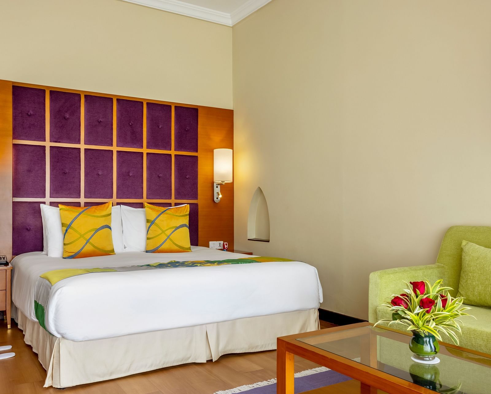 a double bed with side tables and lamps inside Ocean front view - Caravela Beach Resort Goa