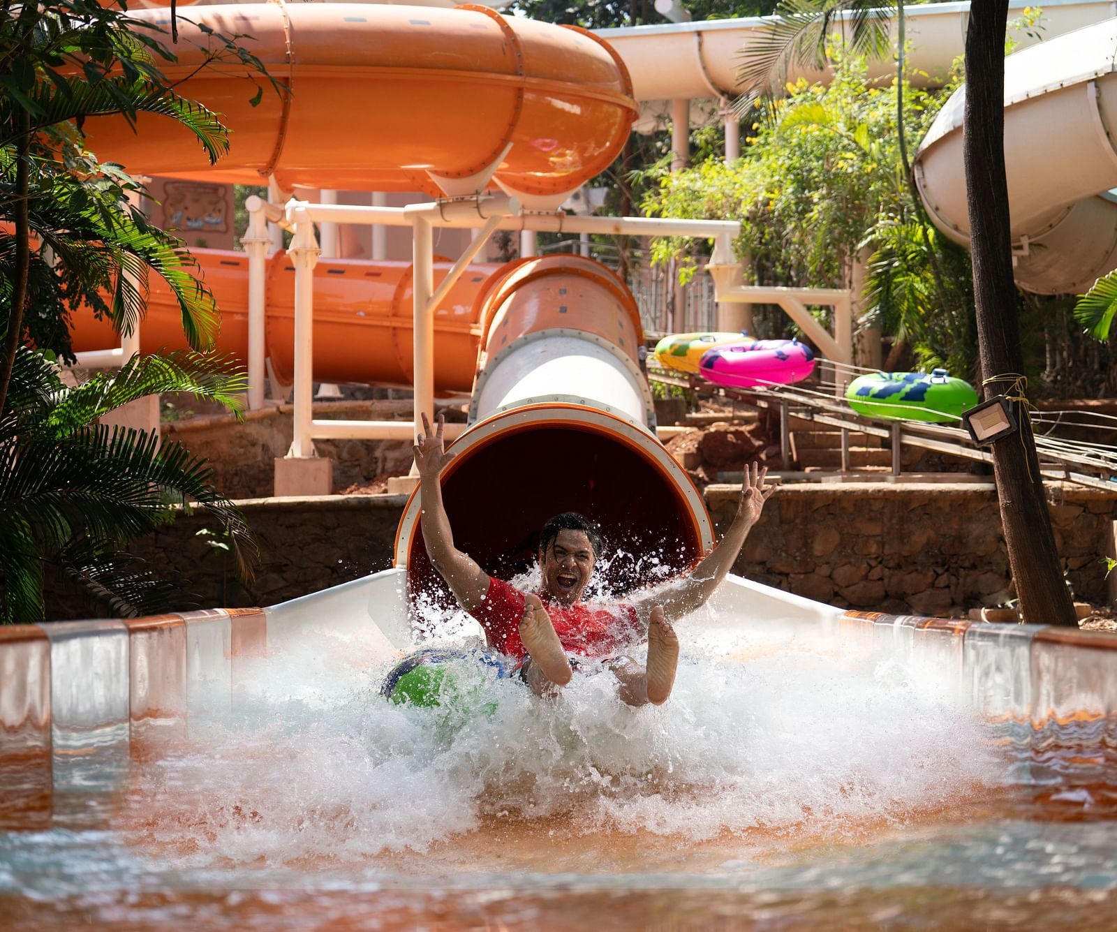 An image of the Aquadrenaline Vortex at Water Kingdom where a man is sliding down into the water