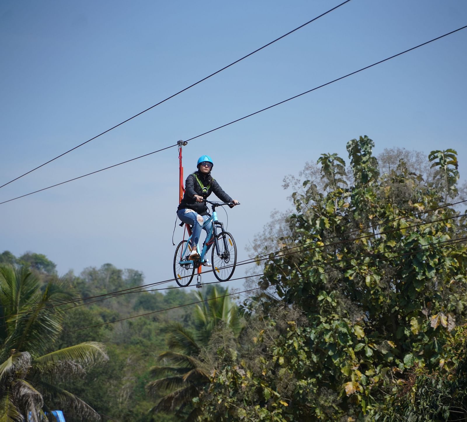 A guest zip cycling at Ravishing Retreat on a sunny day