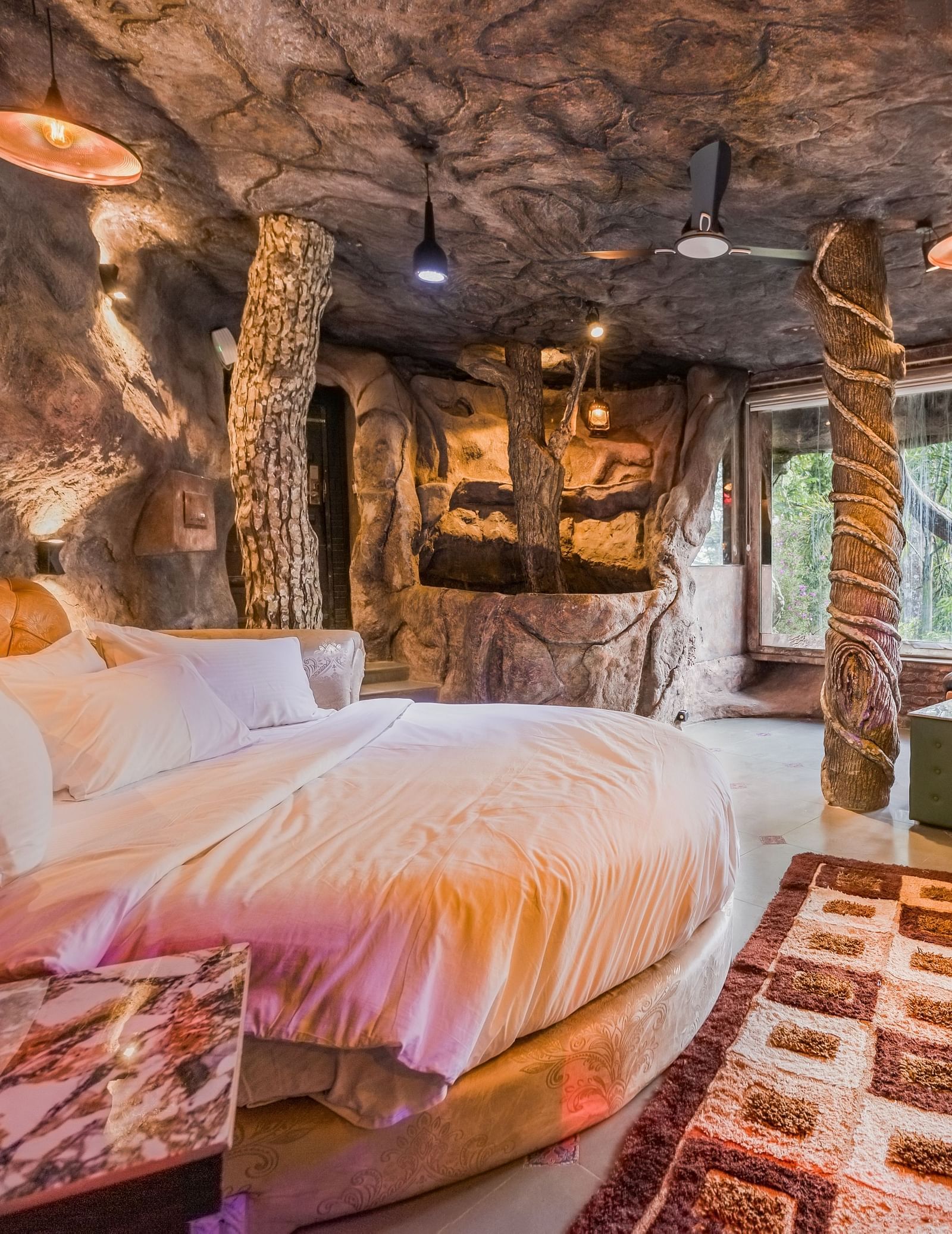 round bed in the Cave Room at Parakkat Nature Hotel and Resorts Munnar 8