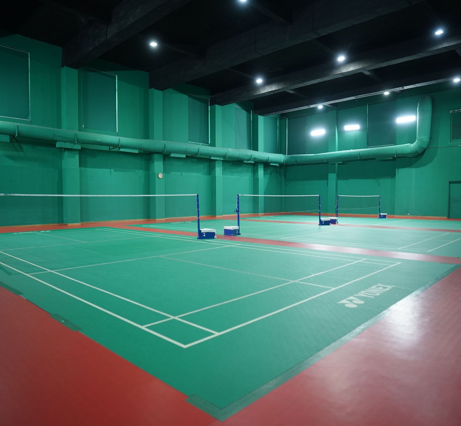 Indoor badminton court at Nirvana Luxury Hotel, Ludhiana