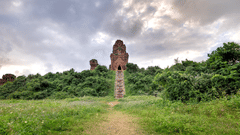 an Old Chennai Temple in the background with a path leading to it 