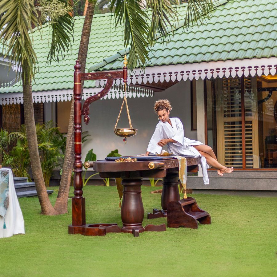 A serene spa and wellness experience with a traditional ceremony setup at Heritage Village Resorts & Spa.