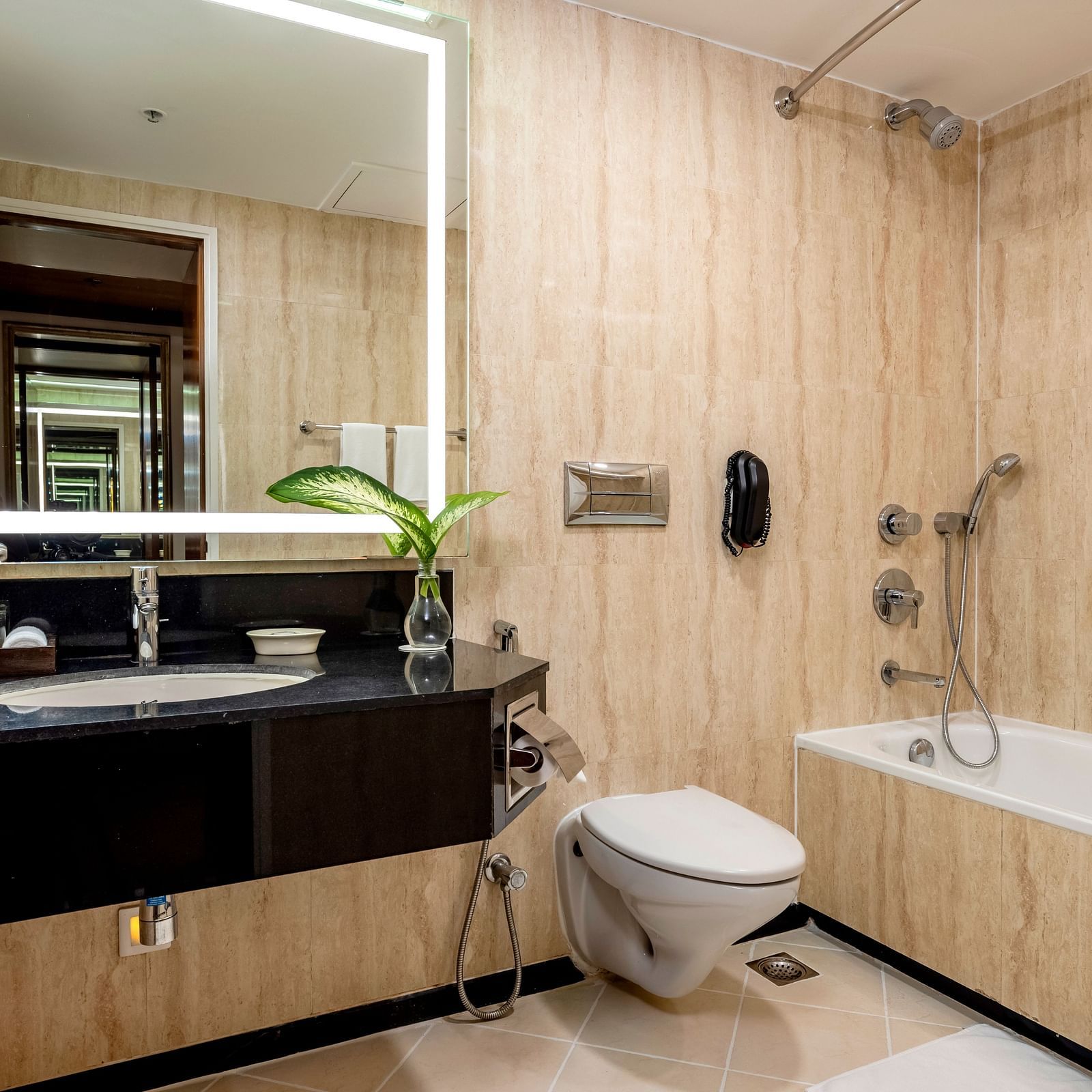 overview of the bathroom with sink area, a bathtub inside Superior Room - Caravela Beach Resort Goa