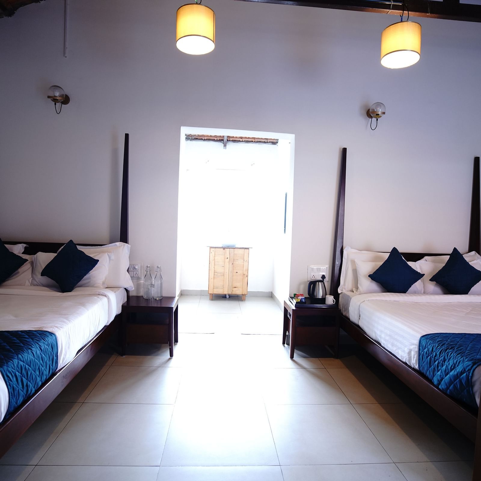The twin bedding and the interiors of the Plumeria 4 Series at Ravishing Retreat