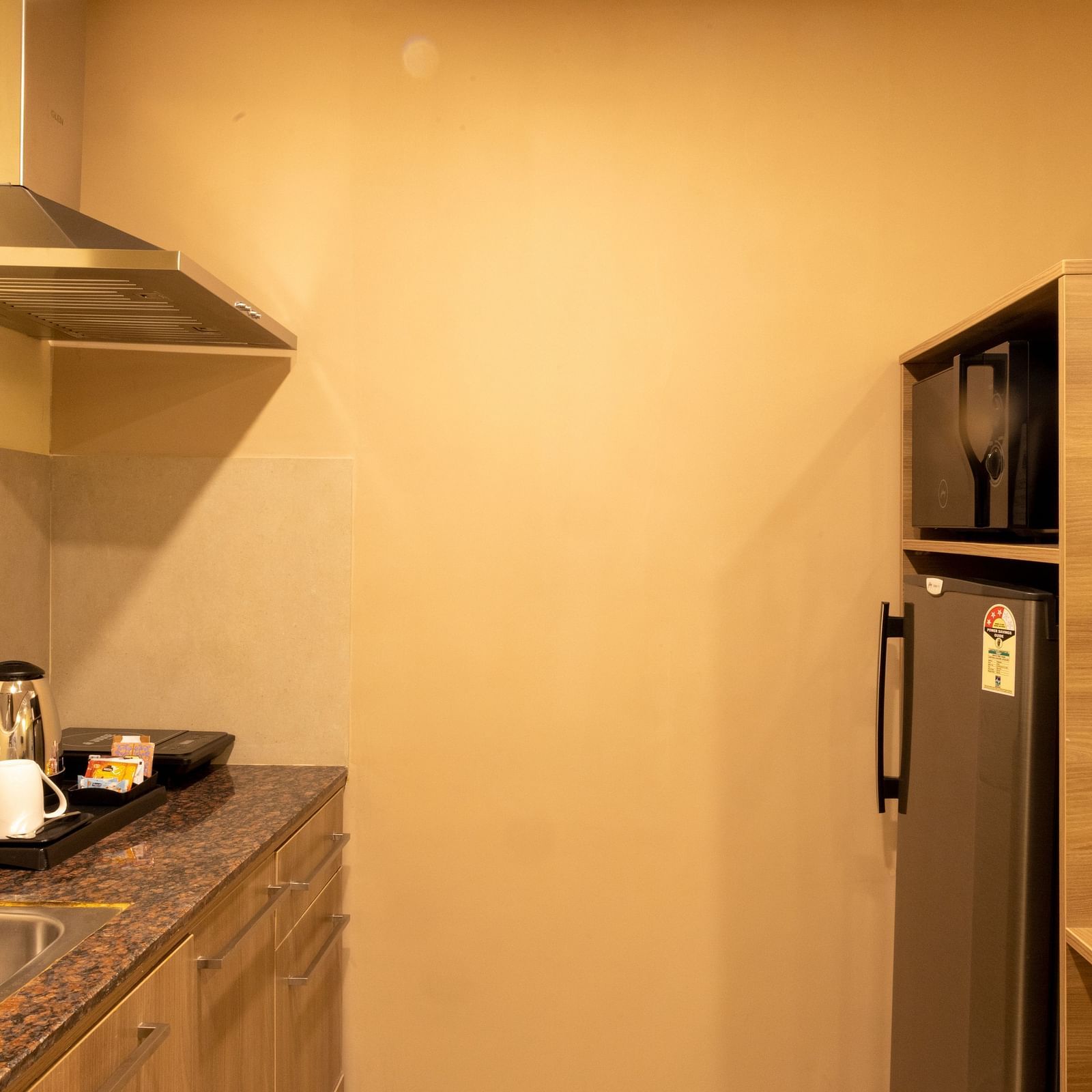 Overview of the kitchen inside one of the rooms - Starlit Suites, Tirupati