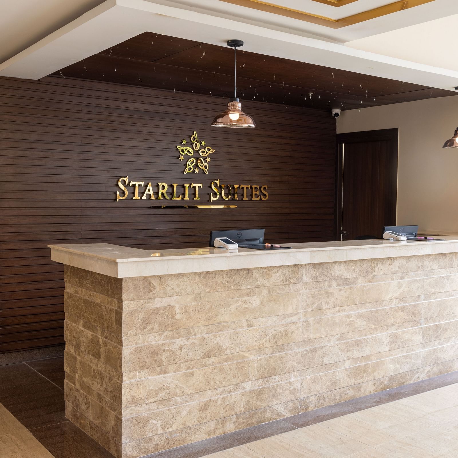 Reception view with a vase on the desk - Starlit Suites, Tirupati
