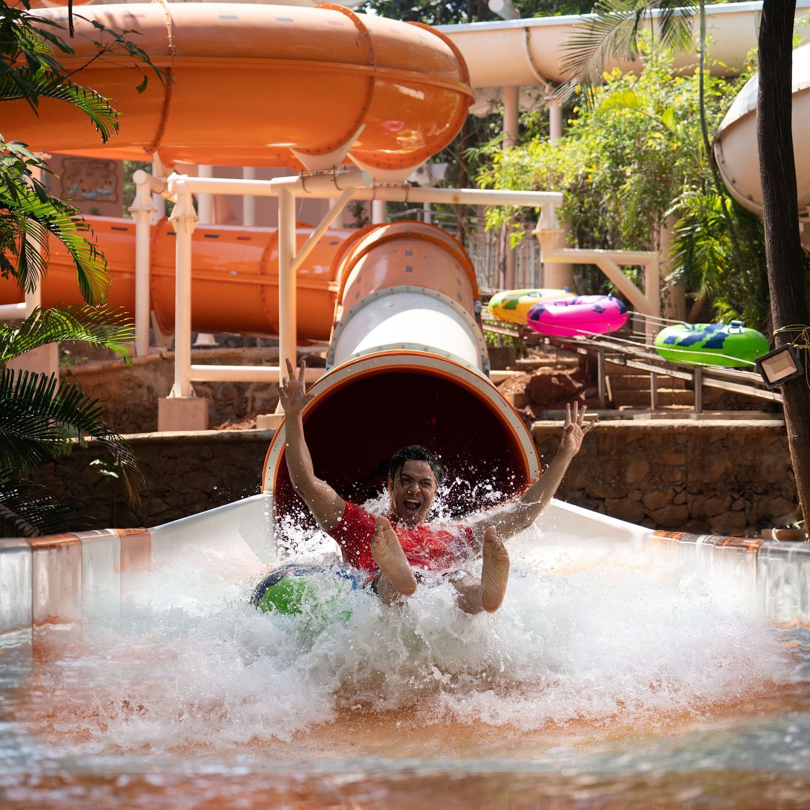 An image of the Aquadrenaline Vortex at Water Kingdom where a man is sliding down into the water