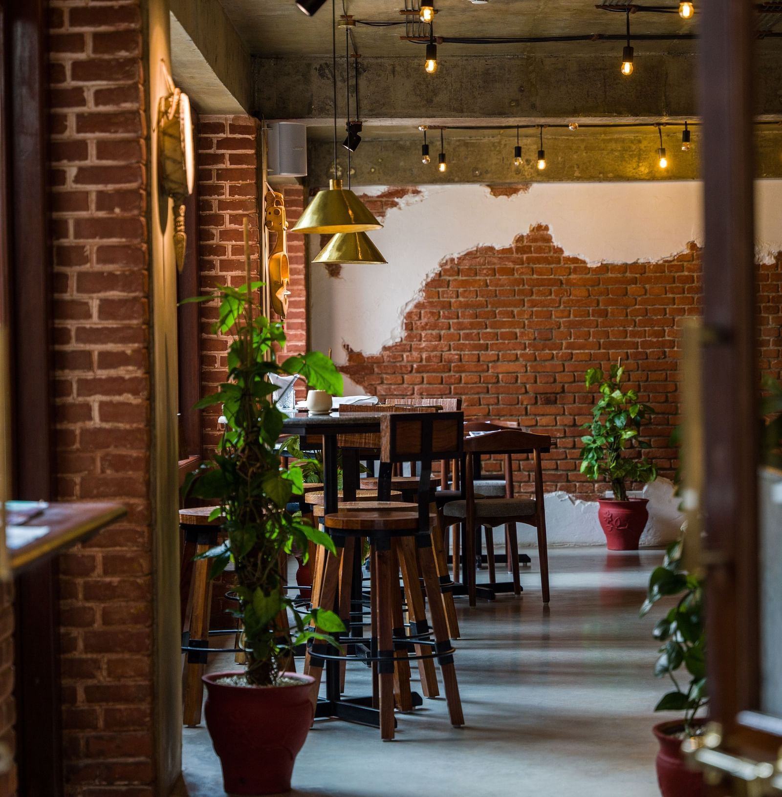 The community bistro at The Nanee with seating arrangement and decorative plants