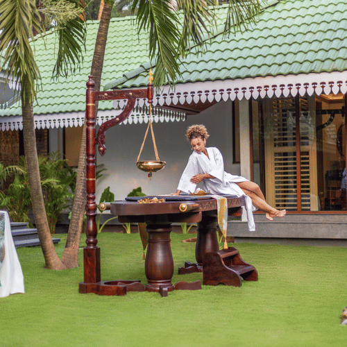 A serene spa and wellness experience with a traditional ceremony setup at Heritage Village Resorts & Spa.