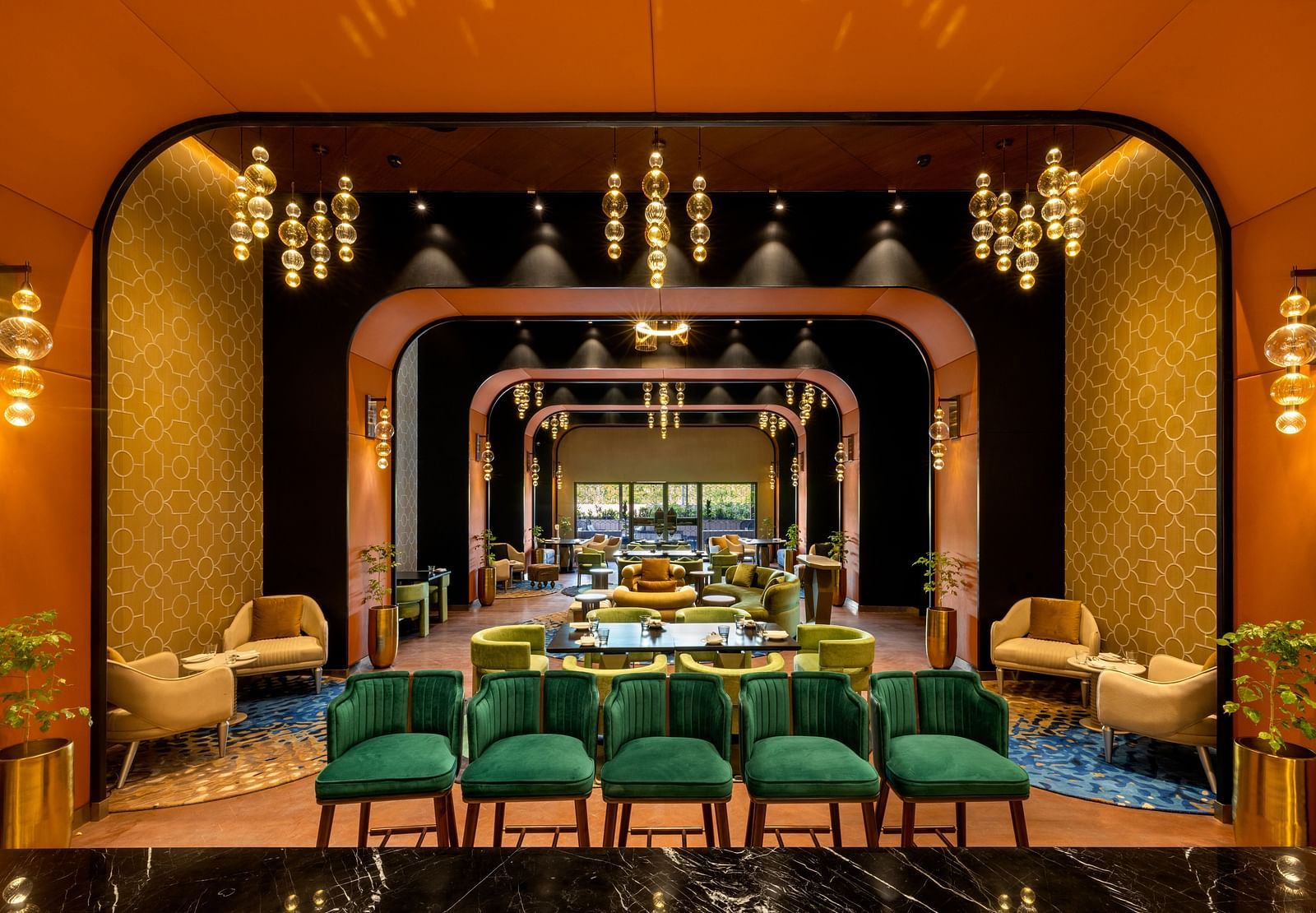 Luxurious dining space in Madurai with golden accents and sophisticated decor - Grand Madurai by GRT Hotels