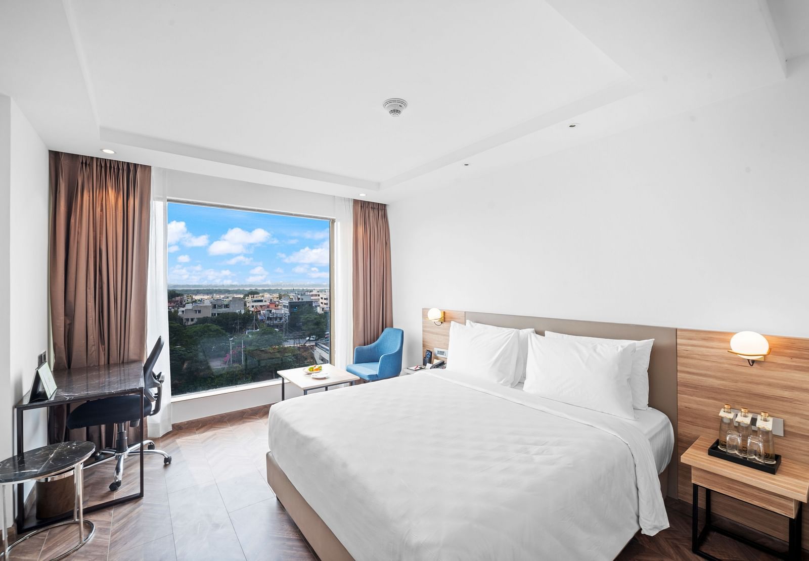 An image of a king size bed of a Grand Club Room at Grand Vijayawada by GRT Hotels.