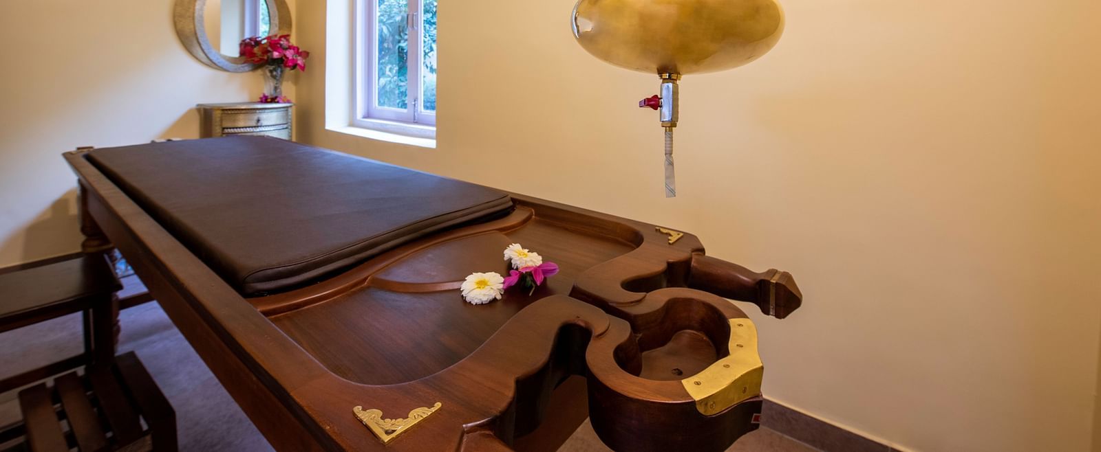 An image of a room with ayurvedic treatment in a spa at BluSalzz Resort.