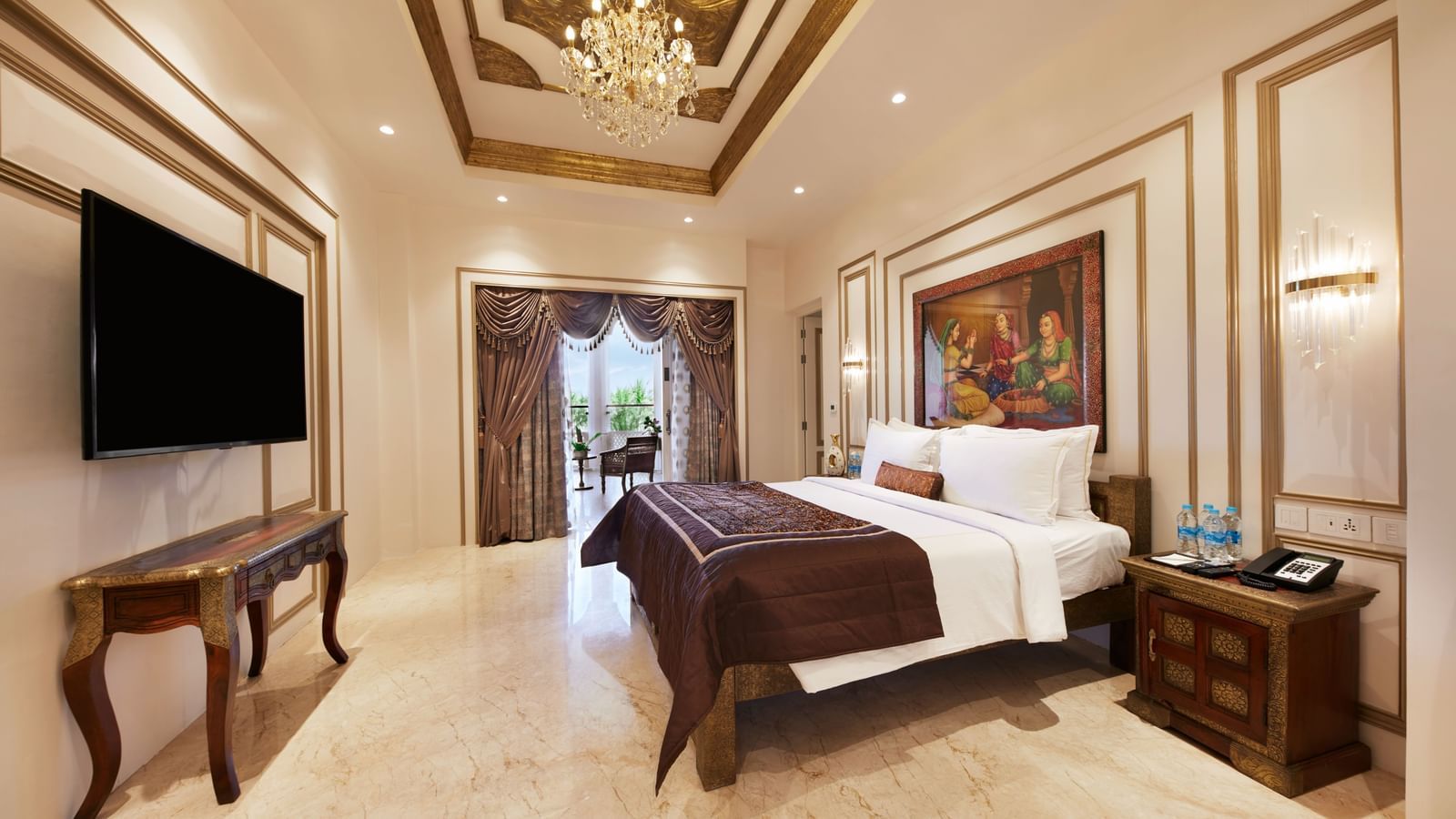 A charming bedroom with a royal bed frame and warm golden lighting – Kaldan Samudra, one of the finest beach resorts in ECR