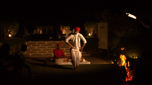 A man singing Rajasthani folk music while another man dances to it - The Baagh Ananta Elite, Ranthambore