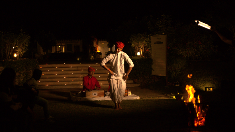 A man singing Rajasthani folk music while another man dances to it - The Baagh Ananta Elite, Ranthambore