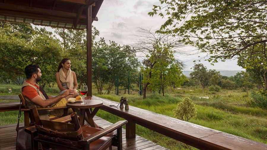 guests admiring the view from Mountain View Log Hut