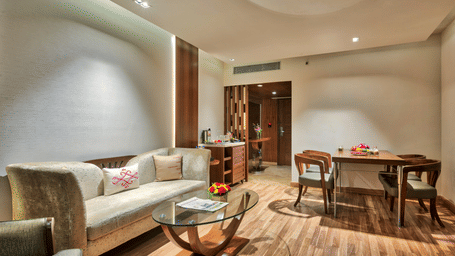 Living Room of Deluxe Suite at Grand Chennai By GRT Hotels.