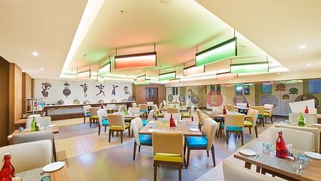 an image of a restaurant with illuminating modern lights  at Zibe Salem by GRT Hotels