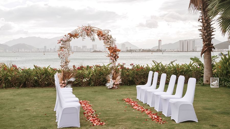 A decorated outdoor area where table and chairs are placed - Alibu Resort Nha Trang