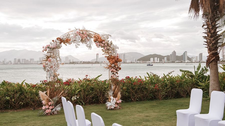 A decorated outdoor area where table and chairs are placed - Alibu Resort Nha Trang