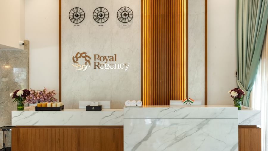 Reception desk with Royal Regency branding and decor at Hotel Royal Regency Chennai