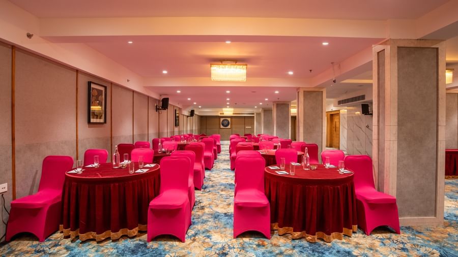 Banquet setup with cluster seating and round tables at Hotel Royal Regency Chennai